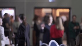 Blurred view of people attending a business conference or networking gathering event indoors - Powered by Shutterstock - Get 15% off with code: PIKWIZARD15