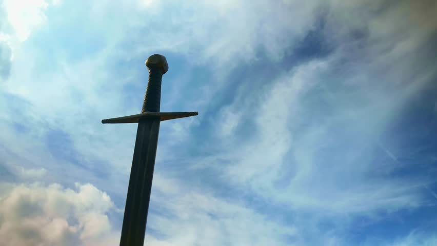 Heroic crusader knights sword silhouette against cloudy sky TIMELAPSE