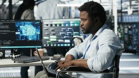 Server room admin with disability interprets machine learning generated data analytics graphs. IT professional in inclusive data center using artificial intelligence showing system metrics, camera B - Powered by Shutterstock - Get 15% off with code: PIKWIZARD15