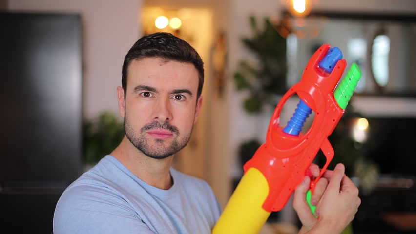 Funny man with his water-gun