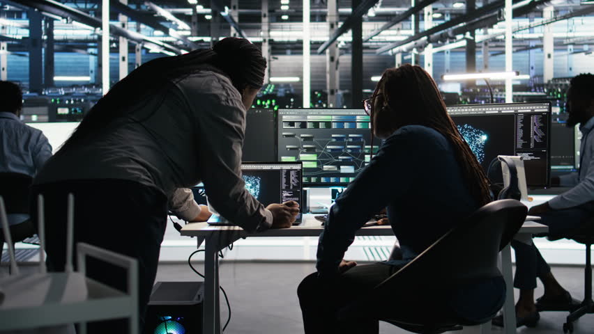 Data center teamworking colleagues use node tree program to identify equipment performance issues. Server hub engineering team coworkers review data analysis graph to minimize failures, camera A - Powered by Shutterstock - Get 15% off with code: PIKWIZARD15