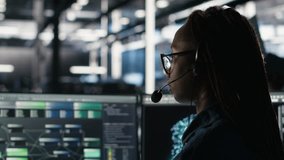 Data center expert examines node tree interface, delivering technical support. Server room technician talking in headset mic with coworkers, using visual programming software, camera B - Powered by Shutterstock - Get 15% off with code: PIKWIZARD15