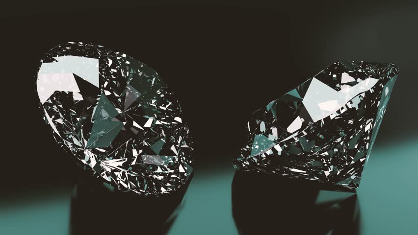 Two brilliant cut diamonds rotate slowly on a reflective dark surface