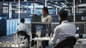 Data center computer scientists use node tree programming to identify equipment performance issues. Server farm employees review data analysis graphs to minimize infrastructure failures, camera A - Powered by Shutterstock - Get 15% off with code: PIKWIZARD15