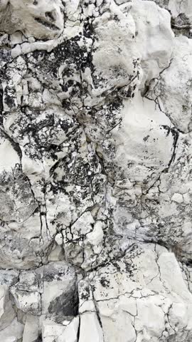 Natural rocky surface with intricate patterns and textures in beige tones, beauty of geological formations