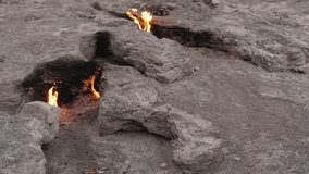 Multiple Eternal Flames Burning from Cracks in the Rocky Terrain at the Chimaera in Turkey, Underground Gas Creating a Unique Natural Phenomenon in a Harsh Landscape - Powered by Shutterstock - Get 15% off with code: PIKWIZARD15