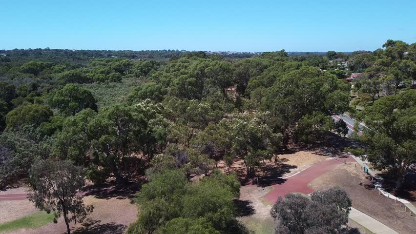 Aerial flyover close to treetops near Joondalup Lake Perth Australia