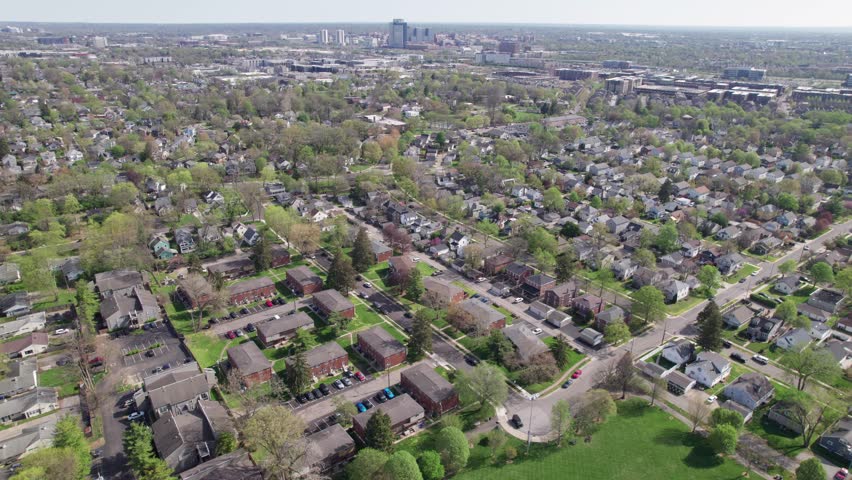 Grandview Heights upper and middle class suburb suburbia neighborhood houses and buildings OSU Ohio State University in the background from drone aerial view establishing shot in Columbus, Ohio city