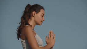 A serene yoga session featuring a woman in activewear meditating and stretching in child s pose on desert sand dunes under a clear blue sky. Perfect for wellness and mindfulness visuals.  - Powered by Shutterstock - Get 15% off with code: PIKWIZARD15