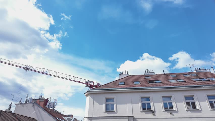 Tower Crane swing action over Prague city rooftop cloud TIMELAPSE