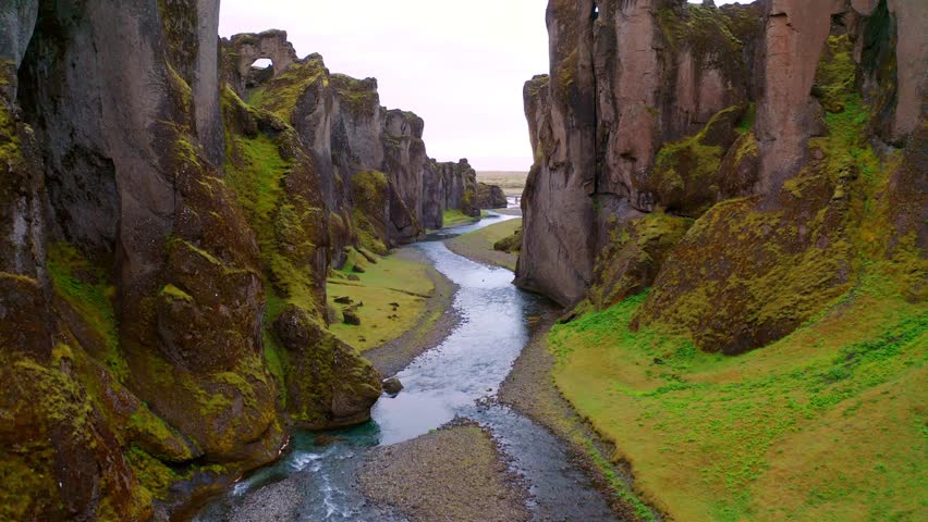 4k drone forward video (Ultra High Definition) of Fjadrargljufur canyon and river. Picturesque summer scene of South east Iceland, Europe. Beauty of nature concept background.