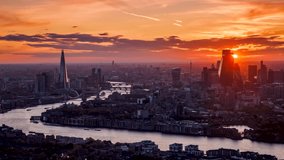 Beautiful, panoramic summer sunset to night time lapse view of the urban skyline of London, United Kingdom, with colorful clouds and red sunlight - Powered by Shutterstock - Get 15% off with code: PIKWIZARD15