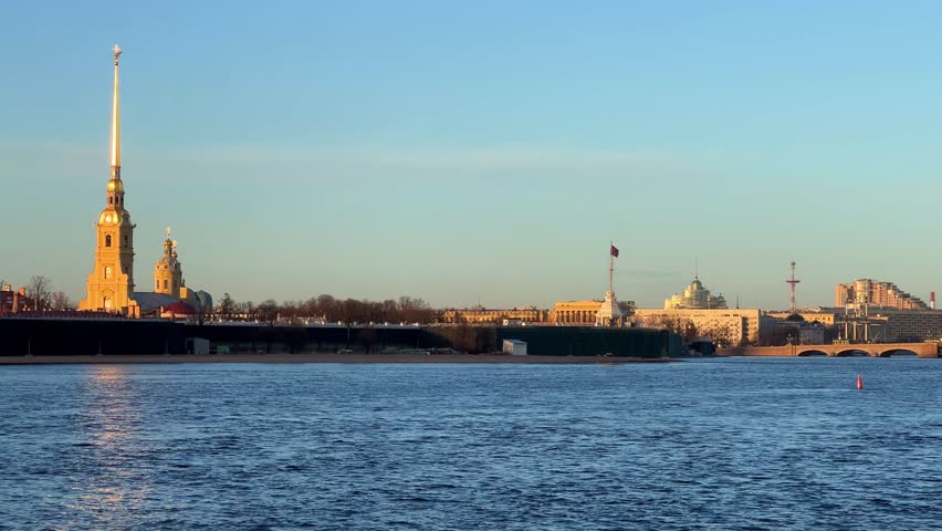 St. Petersburg, Russia - April 20, 2024. View of the sights of the city from the Neva River embankment. Panoramic view of the Neva River and Peter and Paul Fortress, on Zayachy Island. 4К