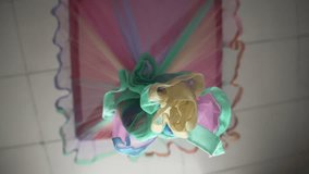 Colorful mosquito net arranged in vibrant hues, suspended as a decorative element, viewed from below. - Powered by Shutterstock - Get 15% off with code: PIKWIZARD15