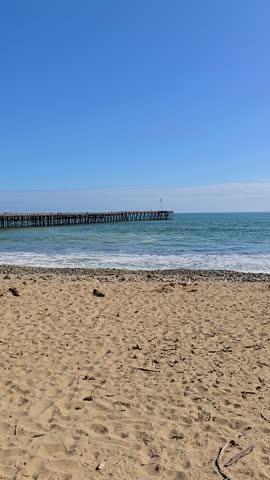 footage of the Ventura Pier with vast blue ocean water and waves at Ventura beach in Ventura California USA
