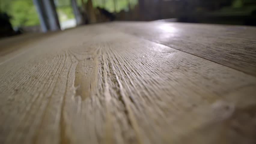 Natural woodgrain texture on sawn timber joinery workspace PULL SHOT 