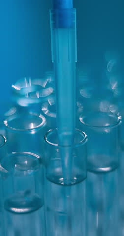 Glass, vial and tube with experiment for test, chemical production or formulation at laboratory. Closeup, science or pipette with liquid samples for scientific exam, new compound or medical research