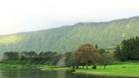 Time Lapse of wilderness landscape from Sete Cidades Lagoon, Sunrays through the clouds, Azores - Powered by Shutterstock - Get 15% off with code: PIKWIZARD15