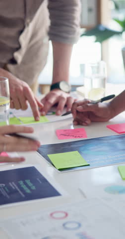 Hands, brainstorming and business people with documents, sticky note or feedback for tech development. Closeup, group or employees in workplace, planning or charts for user experience and cooperation