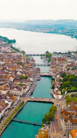 Vertical video. Zurich, Switzerland. Panorama of the city overlooking Lake Zurich. Summer day, Aerial View. Rich colors