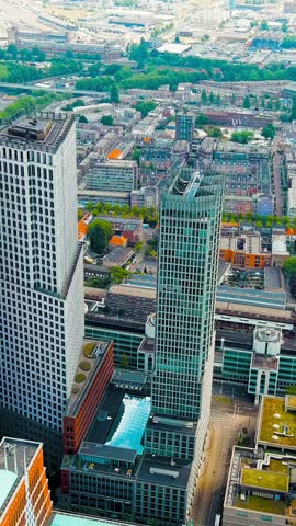 Vertical video. The Hague, Netherlands. Business center of The Hague. Cloudy weather. Summer day, Aerial View. Rich colors