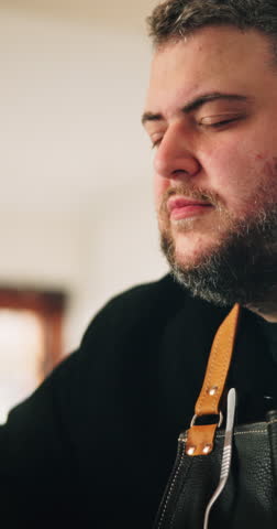 Man, chef and cooking with smell in kitchen for meal, hospitality or catering service at home. Male person, face and steam with aroma, ingredients or flavor for fresh scent, fragrance or food spice