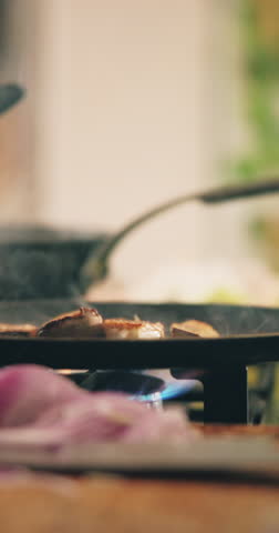 Cooking, stove and hands of chef with mushroom for culinary skills, gourmet recipe and meal prep for dinner. Catering, restaurant and person with ingredients for cuisine, vegetable dish or nutrition