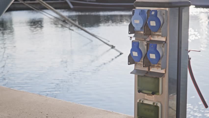 Marina harbour shore power utility for battery charged boat electrics