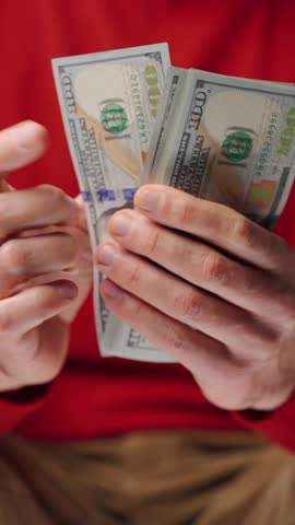 Man counting US Dollar bills, close-up
