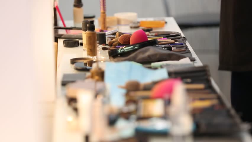 This stock footage showcases the tools and products of a makeup artist, capturing the organized chaos and artistry involved in creating stunning transformations. Perfect for beauty and fashion-related