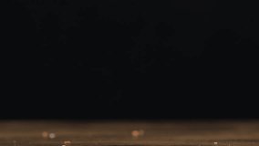 Detailed Slow-Motion Footage of a Chocolate Donut with Sprinkles Descending onto a Table Filmed in Macro at 1000 Frames Per Second - Powered by Shutterstock - Get 15% off with code: PIKWIZARD15