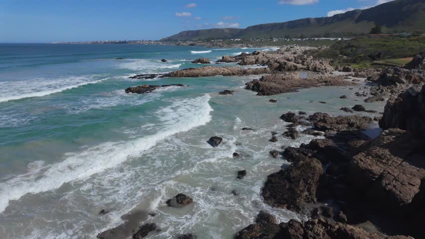 4k 30fps footage of the view of the turquoise Atlantic Ocean along  the Cliff Path near Kammabaai towards , Hermanus, Whale Coast, Overberg, Western Cape, South Africa.