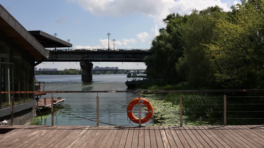 a restaurant terrace with a view of the river