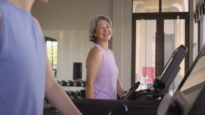 Young active adult child and mature middle age old mum run walk advice workout at gym. Love mental health care older retired mom asia elder people happy protect aging life balance enjoy sport club. - Powered by Shutterstock - Get 15% off with code: PIKWIZARD15