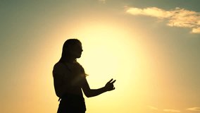 Free girls dance merrily on summer evening, sun. Group of young people having fun dancing with raised hands to music. Celebrate summer day at beach party. Friends have fun at beach party during sunset - Powered by Shutterstock - Get 15% off with code: PIKWIZARD15