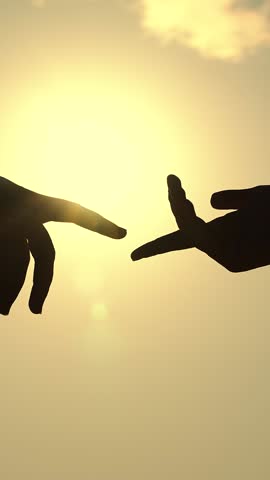 Gentle touch with fingers of hands in sunset. Finger Touching hands, silhouette of man, woman in sun, couple feels love. Reunion of loved ones, family happiness. Hands touching each other. Mercy, love