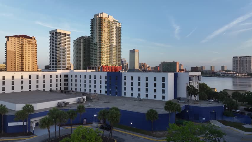 Cityscape aerial view from San Marco and downtown Jacksonville, Florida, on a beautiful blue-sky spring day, with the river, and tall buildings.