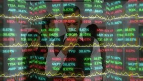 Team operating tablet in corporate office, overlaying dynamic stock tickers and yellow line charts. Finance, technology, data, analytics, innovation, collaboration, modern - Powered by Shutterstock - Get 15% off with code: PIKWIZARD15