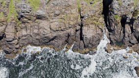 Rocky cliffs with waves crashing into them near Punta del Este in Uruguay - Powered by Shutterstock - Get 15% off with code: PIKWIZARD15