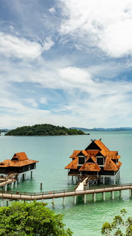 timelapse of paradise bungalows over the sea in langkawi malaysia in vertical
