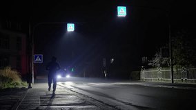 A man runs down the street and drops his mobile phone. during nighttime in an urban city environment - Powered by Shutterstock - Get 15% off with code: PIKWIZARD15