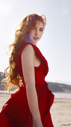 Follow Me Concept Red Haired Woman In Flowing Red Silk Dress Walking On Tropical Beach Slow Motion Vertical Clip Romantic Travel Mood Smiling Model Reaching Out Hand Ocean Breeze Sunset Light