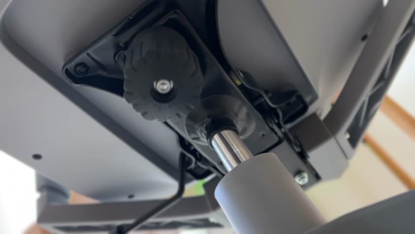 4K footage showing the assembly of an office chair onto a Class-4 gas lift piston. Perfect for ergonomic furniture, chair setup, and assembly visuals.