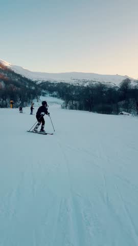Young Man Skiing Down Snowy Slope — Winter Sports and Mountain Adventure