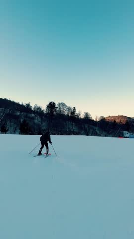 Young Man Skiing Down Snowy Slope — Winter Sports and Mountain Adventure