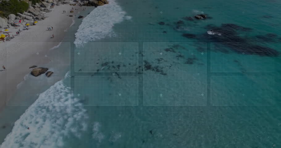 Translucent blue HUD interface hovering above aerial beach scene, revealing grid panels and gauge. Beach, coastline, adventure, technology, ocean, leisure, exploration