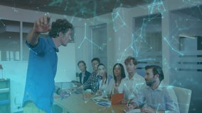 Male presenter gesturing at colleagues in office meeting projecting holographic 6G network on table. Collaboration, innovation, technology, modern, professional, futuristic, teamwork - Powered by Shutterstock - Get 15% off with code: PIKWIZARD15