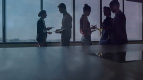 Four professionals discussing global business in office with smartphone, showing network overlay. Corporate, teamwork, innovation, connectivity, modern, collaboration, executive - Powered by Shutterstock - Get 15% off with code: PIKWIZARD15