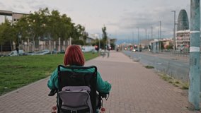 Woman in electric wheelchair enjoying a city ride - Powered by Shutterstock - Get 15% off with code: PIKWIZARD15