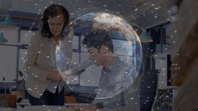Man reviewing blueprints at desk while woman offering plans beside him, showing tech network globe. Collaboration, innovation, technology, digital, professional, communication, productivity - Powered by Shutterstock - Get 15% off with code: PIKWIZARD15